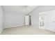 This bedroom features a large closet and access to an ensuite bathroom at 3880 Lake Lanier Dr, Duluth, GA 30097