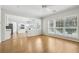 Dining area with hardwood floors and large windows, offering plenty of natural light at 3880 Lake Lanier Dr, Duluth, GA 30097