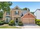 Traditional two story home with well maintained yard and two car garage at 3880 Lake Lanier Dr, Duluth, GA 30097