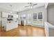 Modern kitchen with white cabinets, quartz countertops, stainless appliances and breakfast bar at 3880 Lake Lanier Dr, Duluth, GA 30097