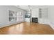 Spacious living room with hardwood floors, a fireplace, and built-in shelves, creating a cozy atmosphere at 3880 Lake Lanier Dr, Duluth, GA 30097