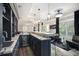 Modern basement bar with sleek cabinetry, marble countertops, and wine cooler at 507 Southshore Ln, Dallas, GA 30157