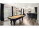 Spacious finished basement with pool table, bar, and ample seating area at 507 Southshore Ln, Dallas, GA 30157