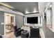 Entertainment room in the basement with a large television, comfortable seating, and custom built-ins at 507 Southshore Ln, Dallas, GA 30157