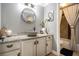 Cozy bathroom featuring a vessel sink with stone countertop and a shower-tub combination with decorative curtain at 507 Southshore Ln, Dallas, GA 30157