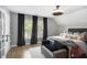 Inviting bedroom boasting large windows, dark wood floors, and stylish furnishings for a comfortable retreat at 507 Southshore Ln, Dallas, GA 30157