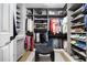 Organized walk-in closet with custom shelving, ample storage space, and stylish decor for shoes and accessories at 507 Southshore Ln, Dallas, GA 30157