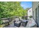 Relax on this beautiful outdoor deck with furniture and views of the backyard at 507 Southshore Ln, Dallas, GA 30157