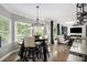 Bright dining area with large windows and hardwood flooring, seamlessly connected to the living room at 507 Southshore Ln, Dallas, GA 30157