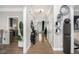 Well-lit hallway with hardwood floors connecting various rooms of the house at 507 Southshore Ln, Dallas, GA 30157