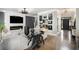 Comfortable living room with modern fireplace, hardwood flooring, and ample lighting at 507 Southshore Ln, Dallas, GA 30157