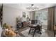 Well-lit home office with modern furnishings, ample desk space, decorative accents, and hardwood floors at 507 Southshore Ln, Dallas, GA 30157