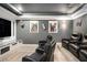 Home theater room with plush seating, large screen, and movie-themed decor at 507 Southshore Ln, Dallas, GA 30157