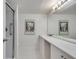 Bathroom with marble countertop vanity, shower and decor at 6851 Roswell Rd # H1, Sandy Springs, GA 30328