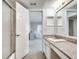 Bathroom view featuring granite countertops and a view into the bedroom at 6851 Roswell Rd # H1, Sandy Springs, GA 30328
