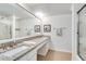 Bright bathroom with granite countertop, double sinks, and a large mirror at 6851 Roswell Rd # H1, Sandy Springs, GA 30328