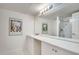 Bathroom featuring a large vanity with marble countertop and a glass-enclosed shower at 6851 Roswell Rd # H1, Sandy Springs, GA 30328