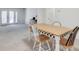 Dining table and four chairs with view to French doors at 6851 Roswell Rd # H1, Sandy Springs, GA 30328