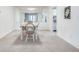 Bright dining room with checkered chairs and a mirrored wall at 6851 Roswell Rd # H1, Sandy Springs, GA 30328