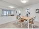 Sunlit dining room features a mirrored wall and a view of the kitchen at 6851 Roswell Rd # H1, Sandy Springs, GA 30328