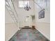 Spacious entryway with tile floor, stairs, and decorative chandelier at 6851 Roswell Rd # H1, Sandy Springs, GA 30328