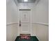 Neutral entryway featuring a decorative doorknocker and floral rug at 6851 Roswell Rd # H1, Sandy Springs, GA 30328
