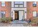 Exterior entrance showcasing classic brick facade, charming details, and inviting entry, adding to curb appeal at 6851 Roswell Rd # H1, Sandy Springs, GA 30328