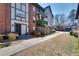 Traditional exterior of home with gray trim, brick, balconies, and a sidewalk at 6851 Roswell Rd # H1, Sandy Springs, GA 30328
