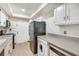 Functional kitchen featuring modern appliances and a white tiled backsplash at 6851 Roswell Rd # H1, Sandy Springs, GA 30328