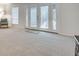 Inviting living room with neutral walls, bright french doors, and lots of natural light at 6851 Roswell Rd # H1, Sandy Springs, GA 30328