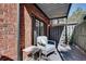 Charming patio with a cozy seating area and views of the surrounding greenery at 6851 Roswell Rd # H1, Sandy Springs, GA 30328