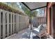 Cozy covered patio with a rocking chair, perfect for relaxing outdoors at 6851 Roswell Rd # H1, Sandy Springs, GA 30328