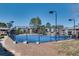 View of the community tennis court with lighting and a fence at 6851 Roswell Rd # H1, Sandy Springs, GA 30328