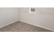 Walk-in closet featuring neutral carpet and a small window at 731 Hedwig Dr, Mcdonough, GA 30252