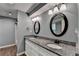 Updated bathroom featuring granite countertops, dual sinks, and modern lighting at 168 Woodland Valley Rd, Lawrenceville, GA 30046