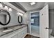 Bathroom with granite countertops, dual sinks, and modern fixtures at 168 Woodland Valley Rd, Lawrenceville, GA 30046