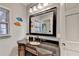 Cozy bathroom features a dark vanity with unique countertop, updated fixtures, and ample natural light at 168 Woodland Valley Rd, Lawrenceville, GA 30046