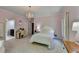 Bedroom with chandelier, pink walls, and ample natural light at 168 Woodland Valley Rd, Lawrenceville, GA 30046