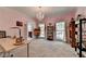 Large bedroom featuring a chandelier, natural light, and plenty of space for activities and decor at 168 Woodland Valley Rd, Lawrenceville, GA 30046