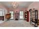 Large bedroom featuring a chandelier, natural light, and plenty of space for activities and decor at 168 Woodland Valley Rd, Lawrenceville, GA 30046