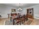 Dining room with hardwood floors, a traditional wood table, and classic decor, creating an inviting space for meals at 168 Woodland Valley Rd, Lawrenceville, GA 30046