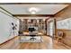 Bright home office features custom built-in bookshelves, wood accents, and hardwood floors, ideal for productivity at 168 Woodland Valley Rd, Lawrenceville, GA 30046