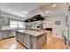 Large kitchen with a granite island and stainless steel appliances, ideal for cooking and entertaining guests at 168 Woodland Valley Rd, Lawrenceville, GA 30046