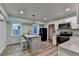 Kitchen area featuring center island, white cabinets and stainless steel appliances at 168 Woodland Valley Rd, Lawrenceville, GA 30046