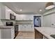 Well-lit kitchen features granite countertops, modern appliances, and white cabinetry at 168 Woodland Valley Rd, Lawrenceville, GA 30046