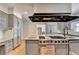 An island cooktop and granite counters are just a couple of features in this spacious kitchen at 168 Woodland Valley Rd, Lawrenceville, GA 30046