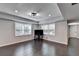Living room with dark hardwood flooring, recessed lighting and large windows at 168 Woodland Valley Rd, Lawrenceville, GA 30046
