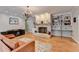 A charming living room has a brick fireplace, hardwood floors, and a tan sofa at 168 Woodland Valley Rd, Lawrenceville, GA 30046