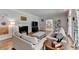 Inviting living room with fireplace, hardwood floors and neutral color palette, creating a cozy atmosphere at 168 Woodland Valley Rd, Lawrenceville, GA 30046