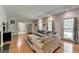 Spacious living room with hardwood floors, comfortable seating, and ample natural light for a bright and airy feel at 168 Woodland Valley Rd, Lawrenceville, GA 30046